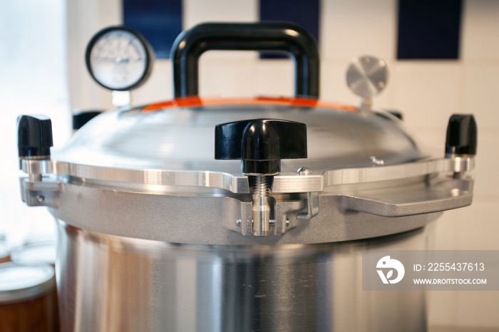 Close up of the lid to a pressure canner. Food preservation is key to gardening and homesteading. Pressure canning makes food shelf stable.