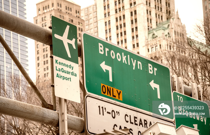 Brooklyn Bridge and Airports street signs in New York City