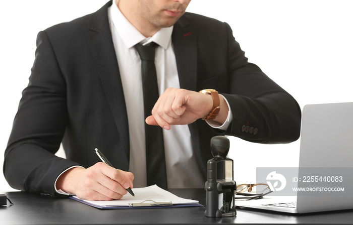 Male lawyer working with document in office