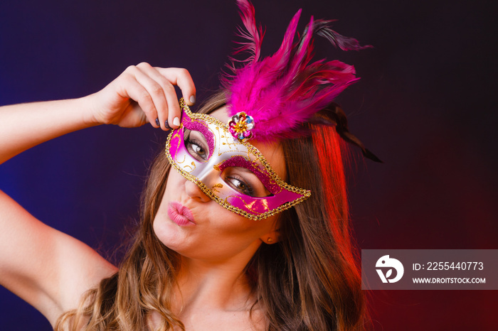 Closeup woman face with carnival mask on dark