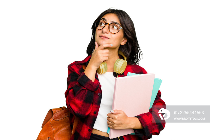 Young student Indian woman wearing headphones isolated looking sideways with doubtful and skeptical expression.