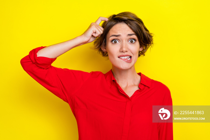 Closeup photo of adorable nice business lady thinking solving financial problems scratch head pouted lips look empty space isolated on yellow color background