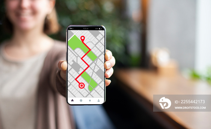Smartphone With Opened Gps Navigation Online Maps On Screen In Female Hand