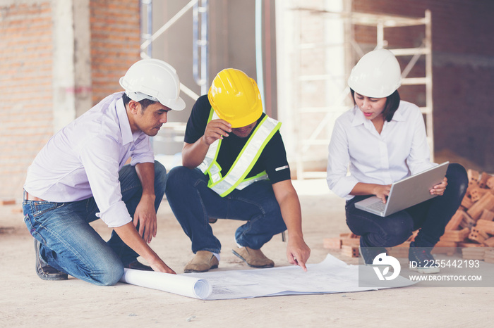 architect and engineer inspect housing estate building to success construction plan before send quality housing to customers ;Showing thumb up for good teamwork .