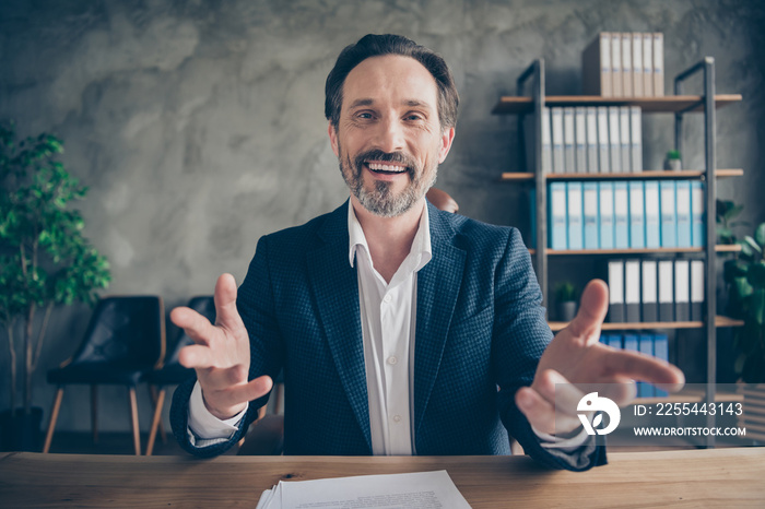 Close-up portrait of his he nice attractive cheerful friendly man insurance sales expert consulting client meeting appointment briefing at modern concrete industrial work place station