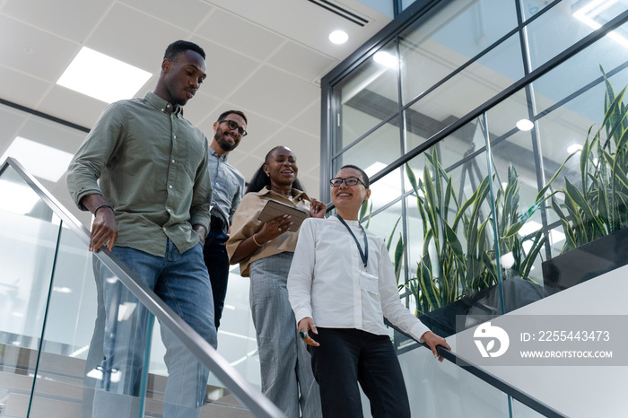 Office workers walking on steps