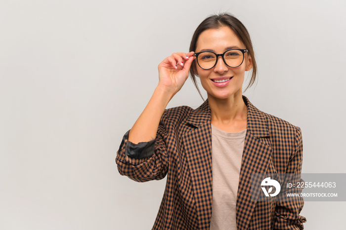 Beautiful young confident businesswoman wearing glasses portrait. Studio shot, isolated on white background. Stock photo