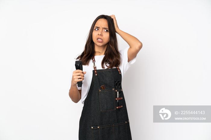 Young hairdresser woman isolated on white background having doubts while scratching head