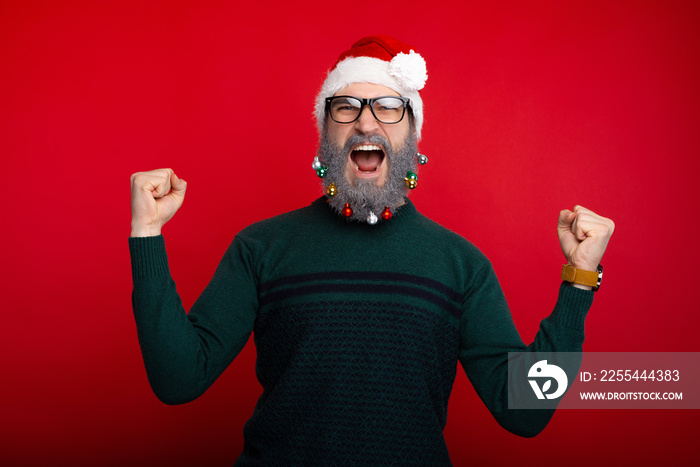 Crazy excited man with white decorated beard celebrate victory