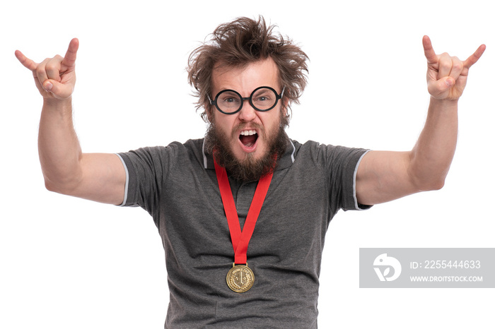 Happy winner. Crazy bearded Man in eye Glasses celebrating his success. Cheerful Guy with gold Medal, screaming and making rock and roll sign, isolated on white background.