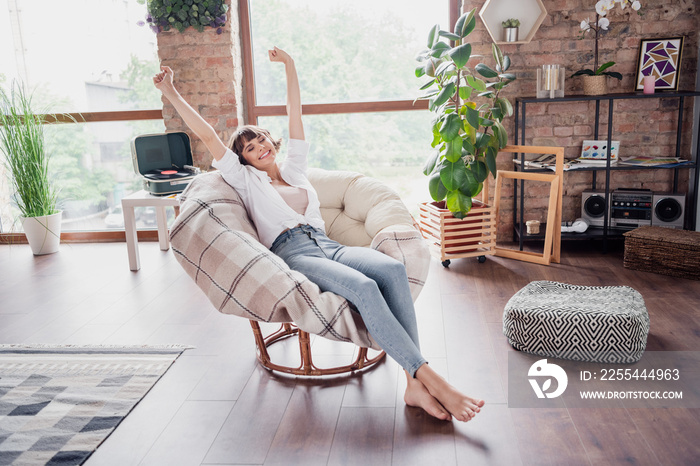 Full length body size photo woman relaxing in armchair on weekend at home chilling smiling