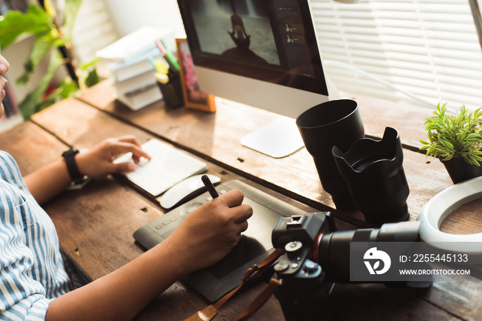 Photographers are retouching photos in the studio.