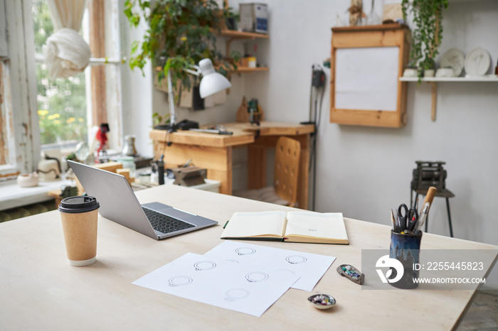 Background image of workplace with designs and computer in workshop studio, copy space