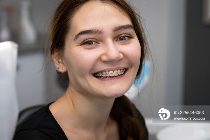 happy woman with braces, dental clinic