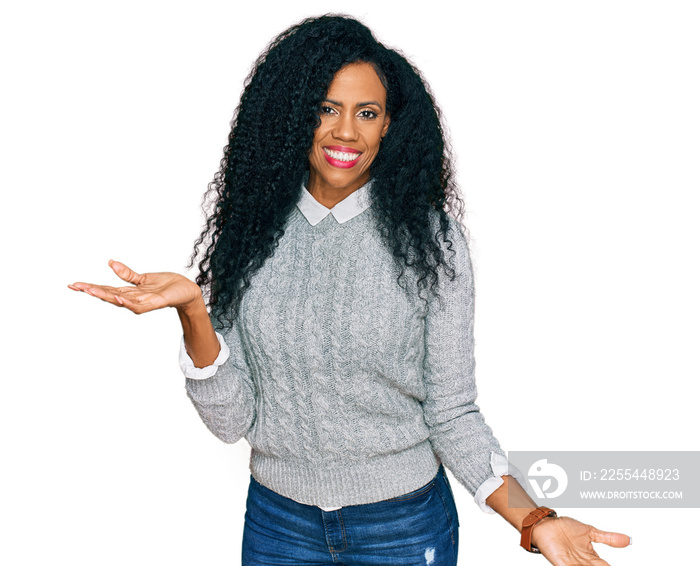 Middle age african american woman wearing casual clothes smiling cheerful with open arms as friendly welcome, positive and confident greetings