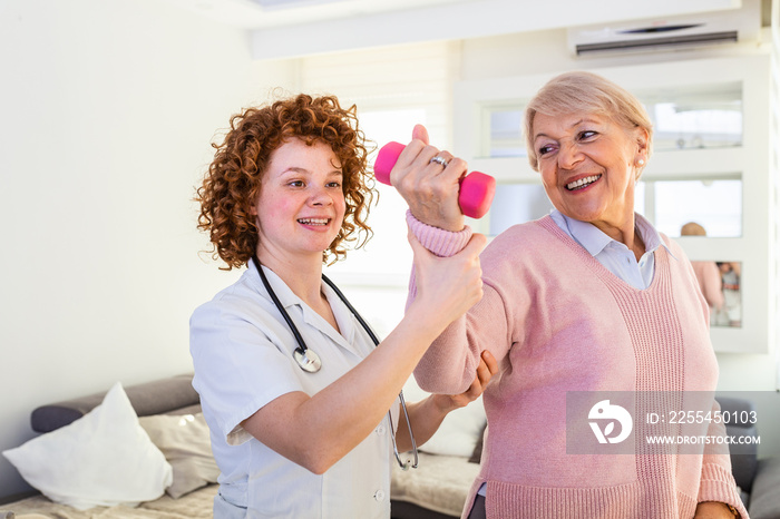 Senior woman after stroke at nursing home exercising with professional physiotherapist. Elder woman returning to good health. physiotherapist nurse helping an elderly women physical rehabilitation