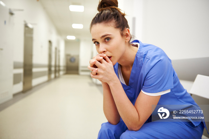 Close up of upset female nurse in the corridor