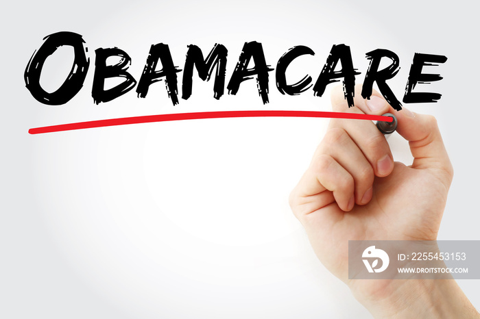 Hand writing Obamacare with red marker, health concept