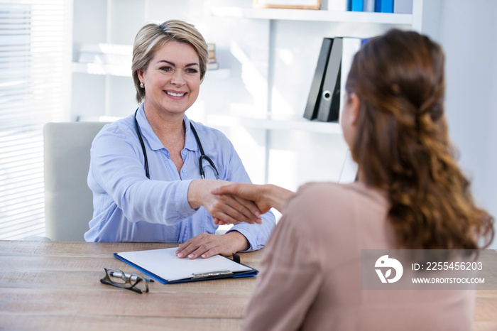 Doctor shaking hands with patient