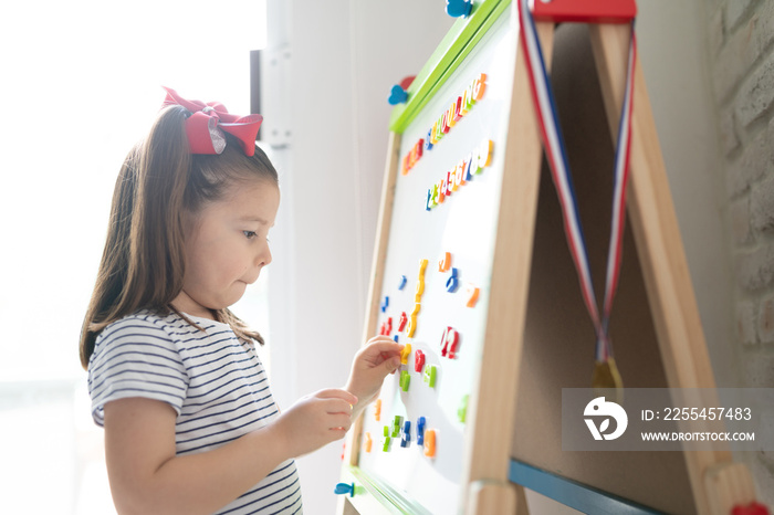 Little girl learning the alphabet