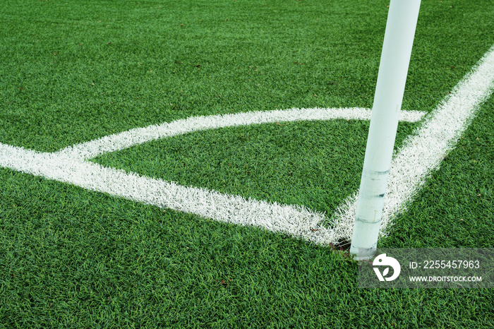 Close up of the corner on a green soccer field