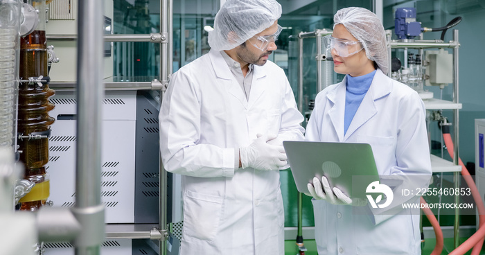 Scientist team working together in the medical laboratory, Researchers using computer laptop consulting in the laboratory, Medical laboratory concept