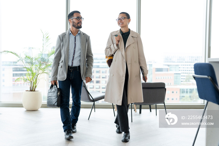 Office workers walking together in hallway