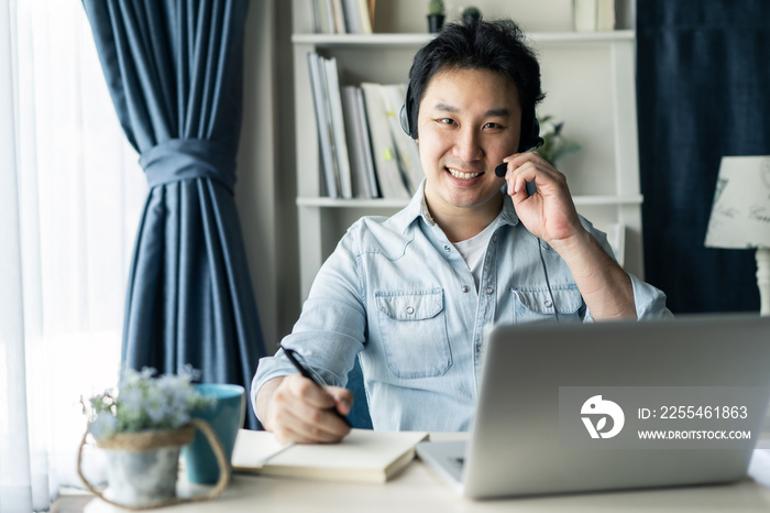 Asian businessman talking to colleague team in video call conference.