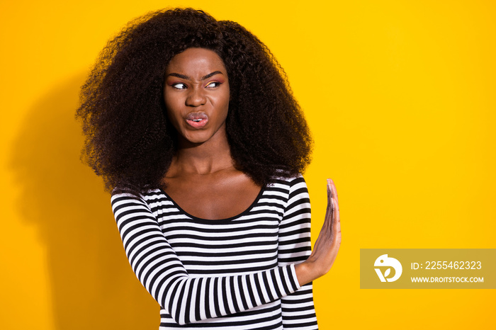 Photo portrait of young woman looking copyspace disgusted rejecting refusing isolated vivid yellow color background