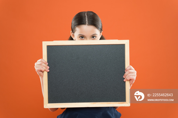 Topic of todays lesson. School schedule information. School girl pupil hold blackboard copy space. School news concept. Informing kids changes in school life. Check out responsibilities of pupils