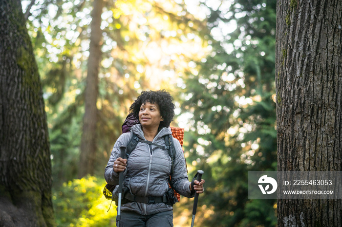 U.S. Army female soldier putting in the miles with an early morning hike in the NorthWest.