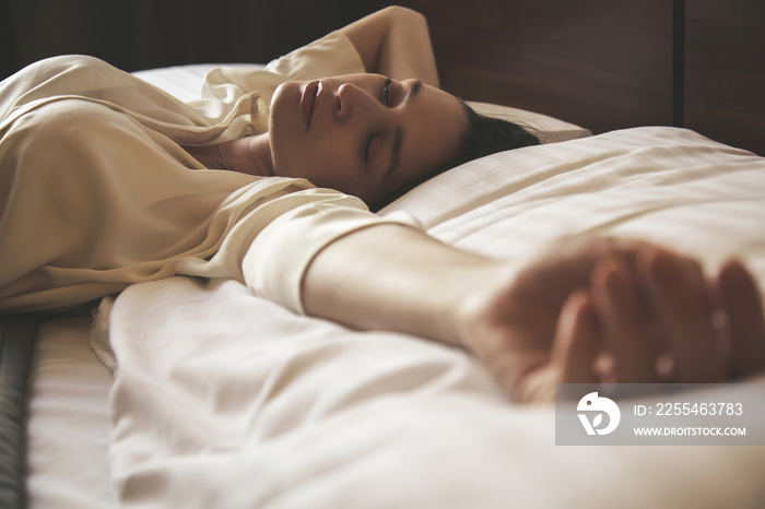 Young woman sleeping, side view, candid style image