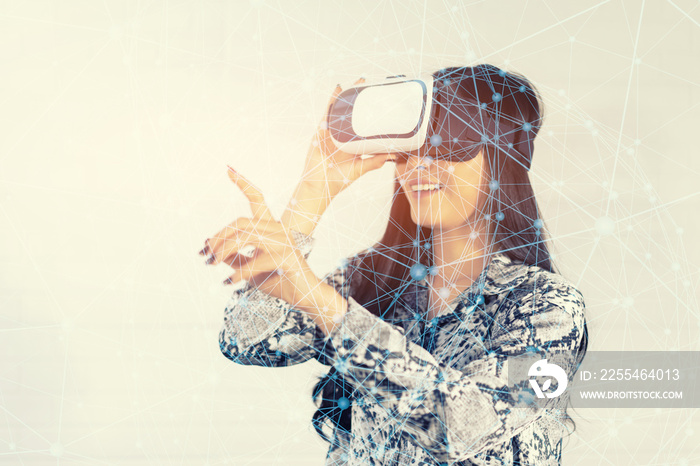 Girl with Smartphone using VR Box google 3D Virtual Reality Glasses headset , Asian woman with Modern imaging Future technology.simulation training with the Ai hologram,internet of things(iot) concept