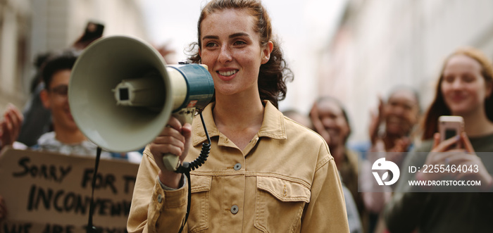 Woman demonstrator protesting with megaphone