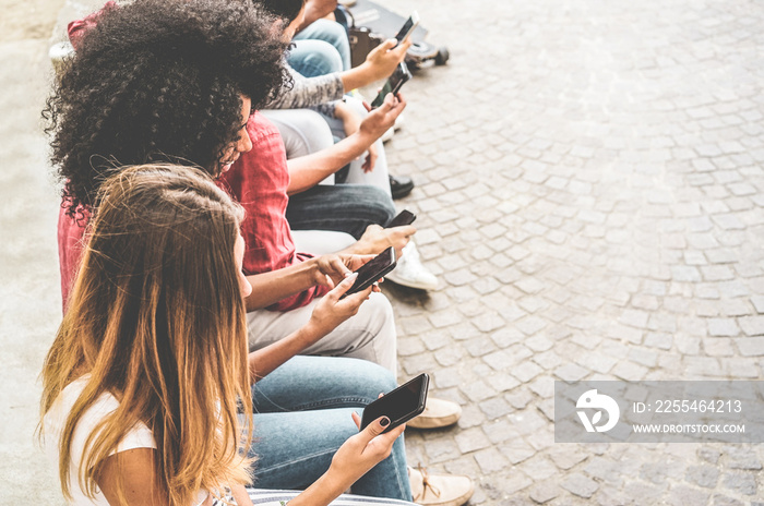 Happy millennials friends surfing online with mobile phones