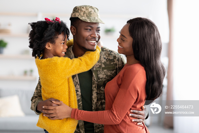 Happy Black Wife And Daughter Welcoming Military Father At Home After Army