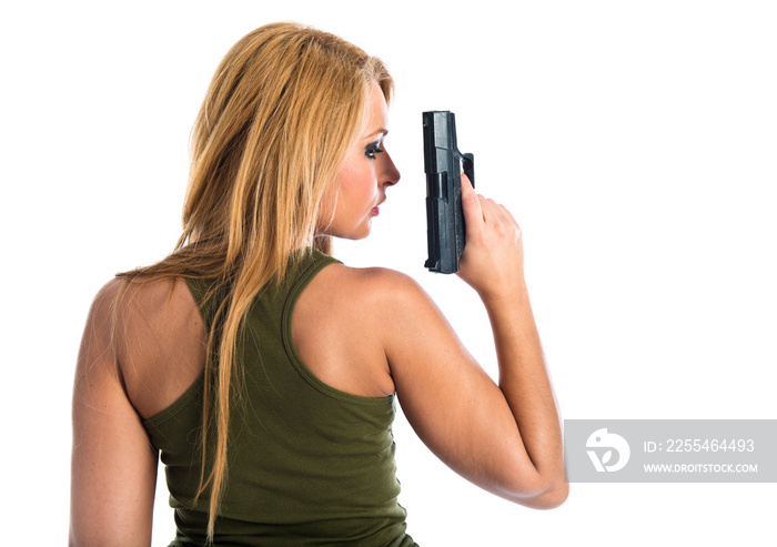 Military woman aiming a gun