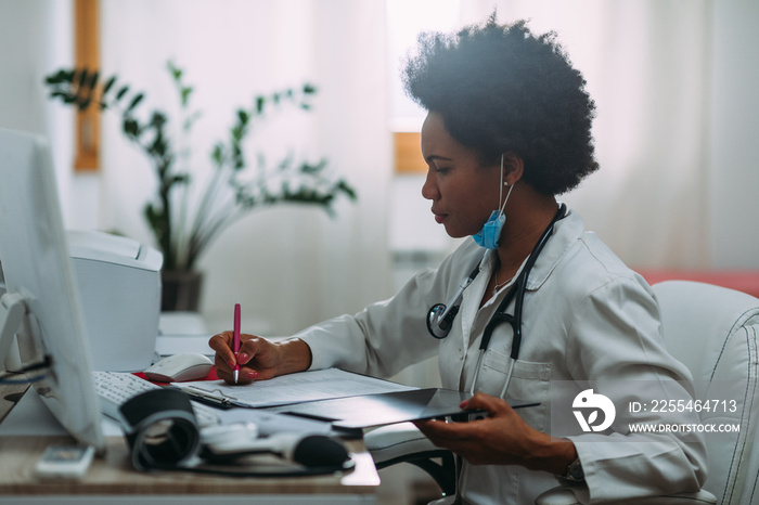 Doctor working in her office