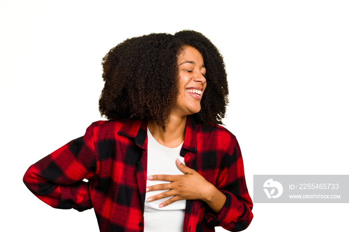 Young African American woman isolated laughing keeping hands on heart, concept of happiness.