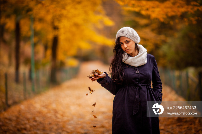 portrait of a woman in a park autumn season