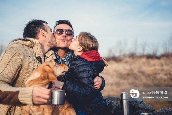 Gay parents with daughter and dog