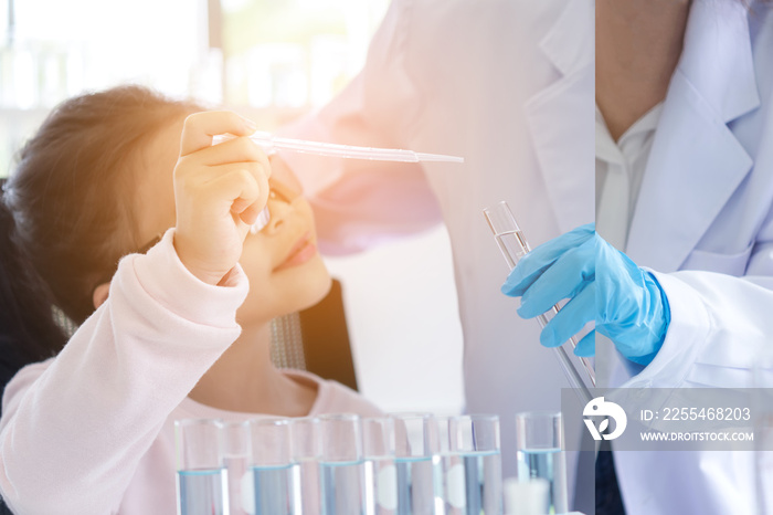 Asian children analyzing study evaluating microscope with scientist. Health care researchers doing some research with dropper chemical testing and working in life science laboratory