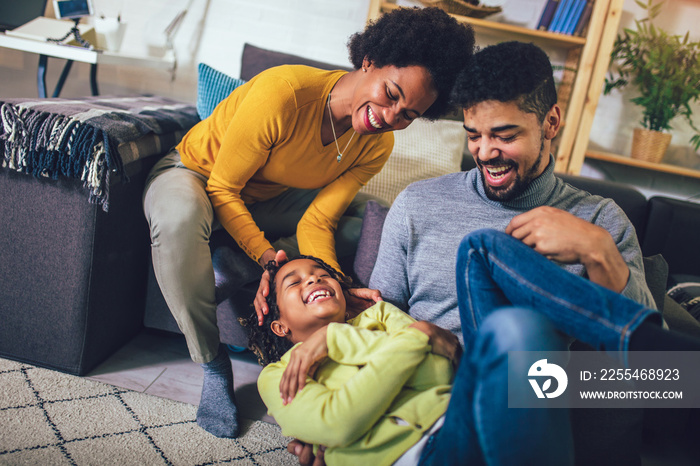 Happy african american family having fun at home.