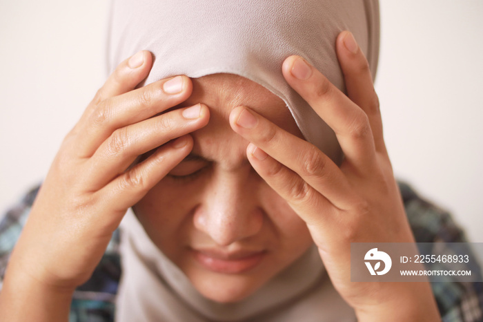 Sad depressed anxiety Asian muslim woman thinking contemplating bad thing happened in her life, stress exhausted feeling down expression, financial or relationship problem