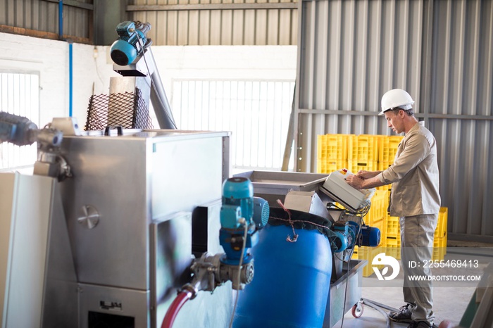 Attentive technician operating a machine