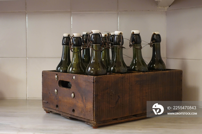 Vintage style bottle in wooden box, kitchen decoration