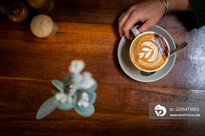 Hot steaming almond milk coffee being make in Australia.