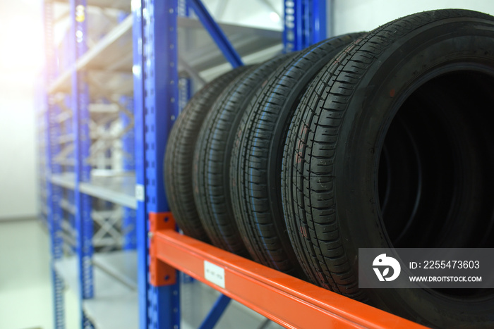 Large modern warehouse with forklifts and stack of car tires