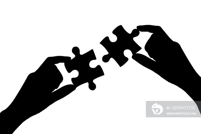 two hands of businesswomen to connect couple puzzle piece with sky background.Jigsaw alone wooden puzzle against sun rays.one part of whole.symbol of association and connection.business strategy