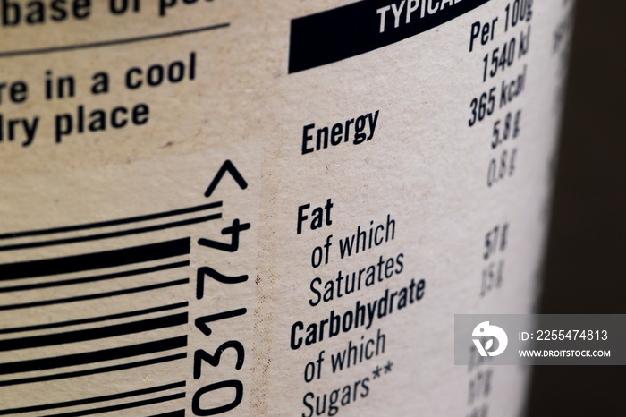 Fat content information displayed on food packaging label with shallow depth of field